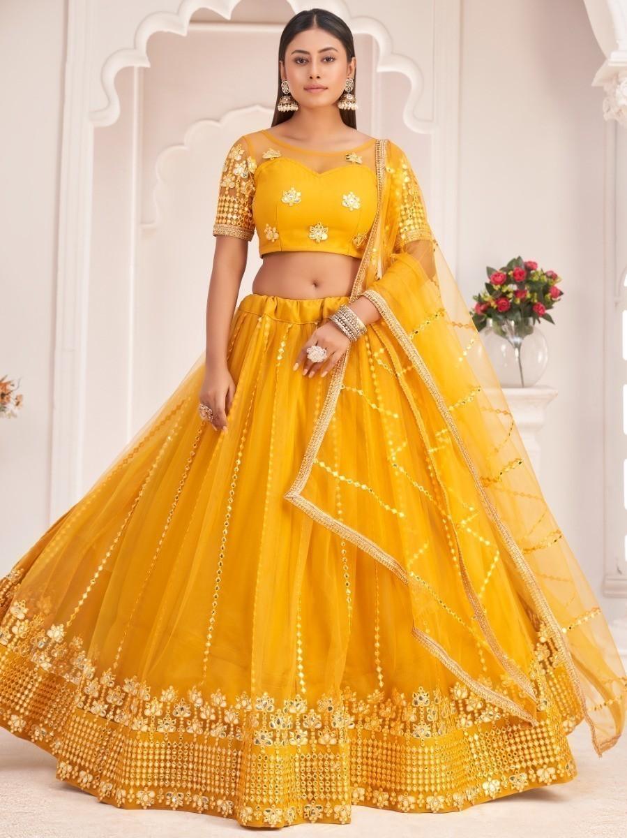 Mustard yellow lehenga choli with sequins and white thread embroidery for women.