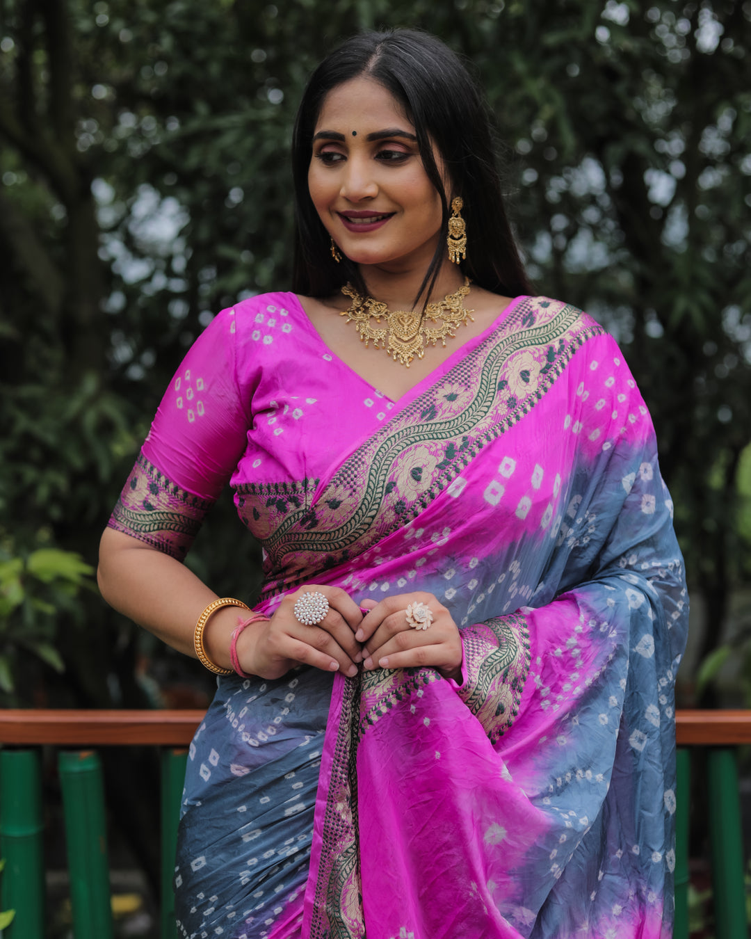 Stunning bright-pink Bandhej Tapeta silk saree with intricate Bandhej design and dual-tone effect.