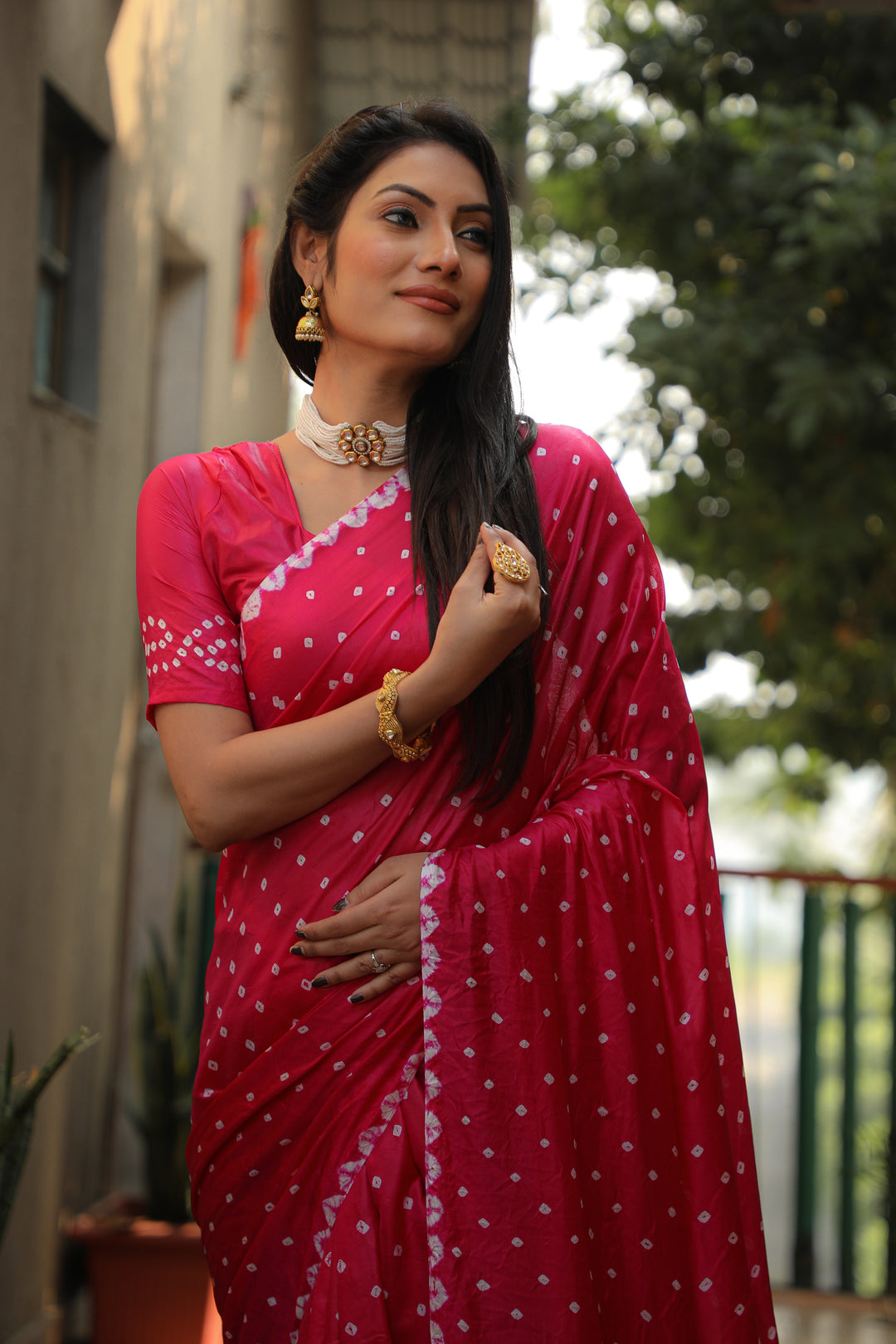 Stunning bright-pink Bandhej silk saree with intricate checks design, perfect for traditional wear.