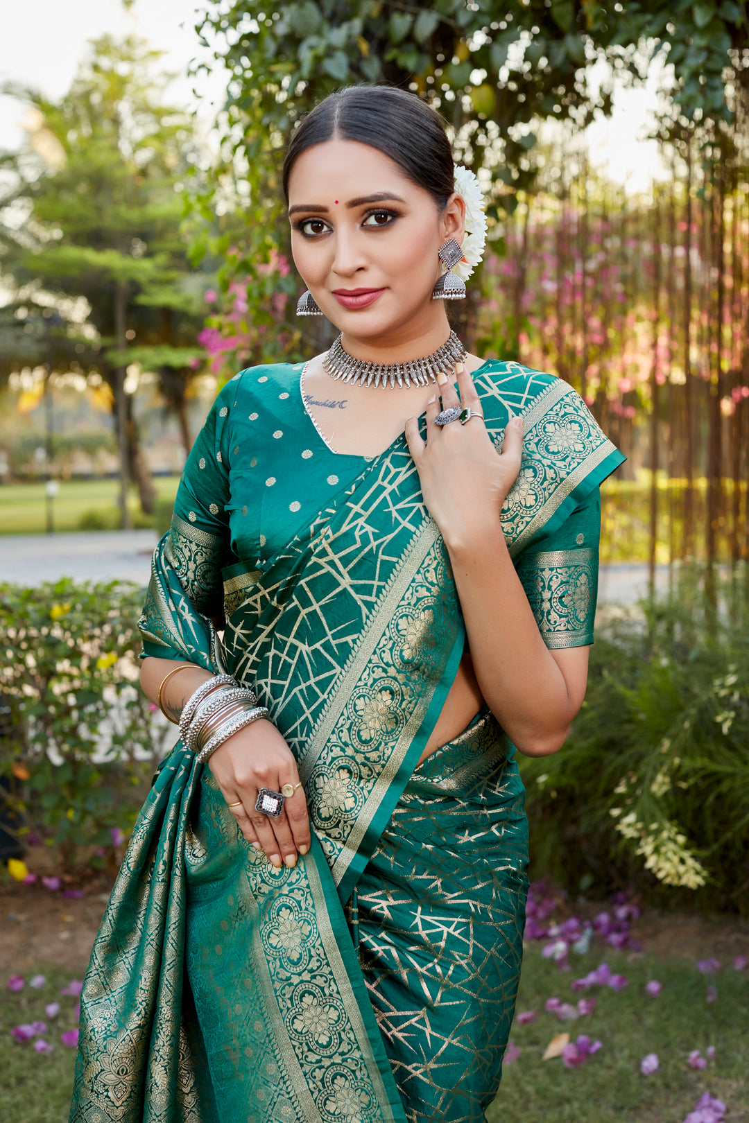 Gorgeous blue Kanjivaram soft satin silk saree with intricate butta work, perfect for bridal and luxury celebrations.