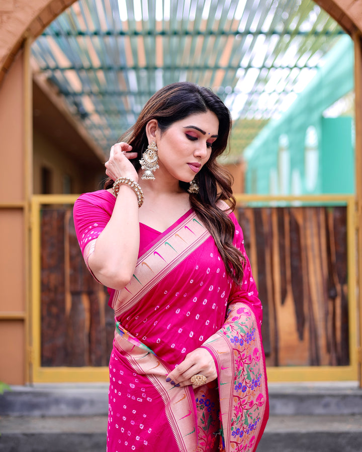 Bright pink Bandhej Paithani silk saree with a beautiful zari border and Paithani pallu, perfect for weddings and celebrations.