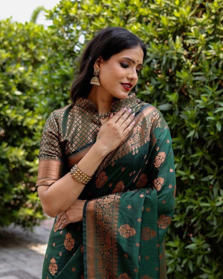 Deep green soft silk saree with intricate copper weaving, offering a graceful and sophisticated look for any celebration.