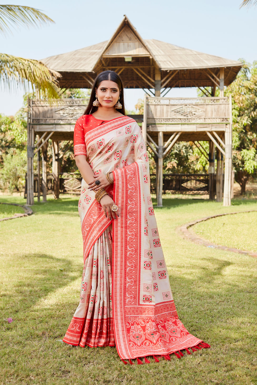 Luxurious cream Kanjivaram soft silk saree with traditional motifs and beautiful designer borders.