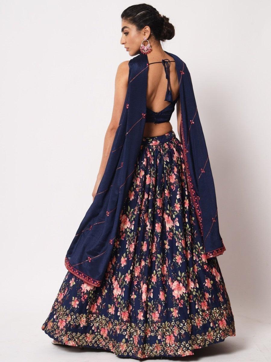 Navy blue lehenga with embroidered choli and sequins detail.