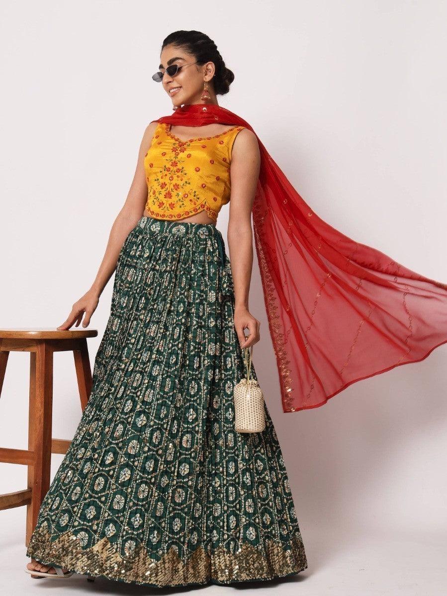 Elegant green lehenga choli with yellow floral embroidery.