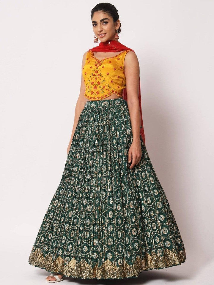 Green lehenga with multi-colored dupatta and sequin details.