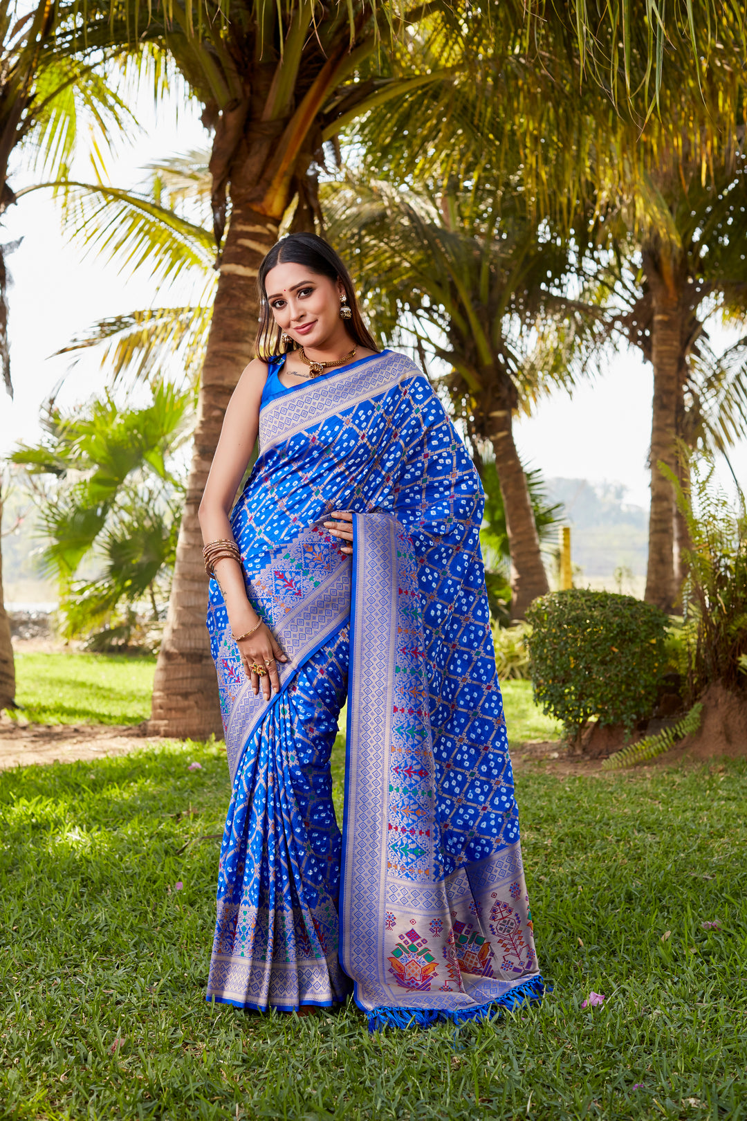 Purple Gharchola Bandhej silk saree with exquisite zari weaving and meenakari borders, perfect for cultural events and weddings.