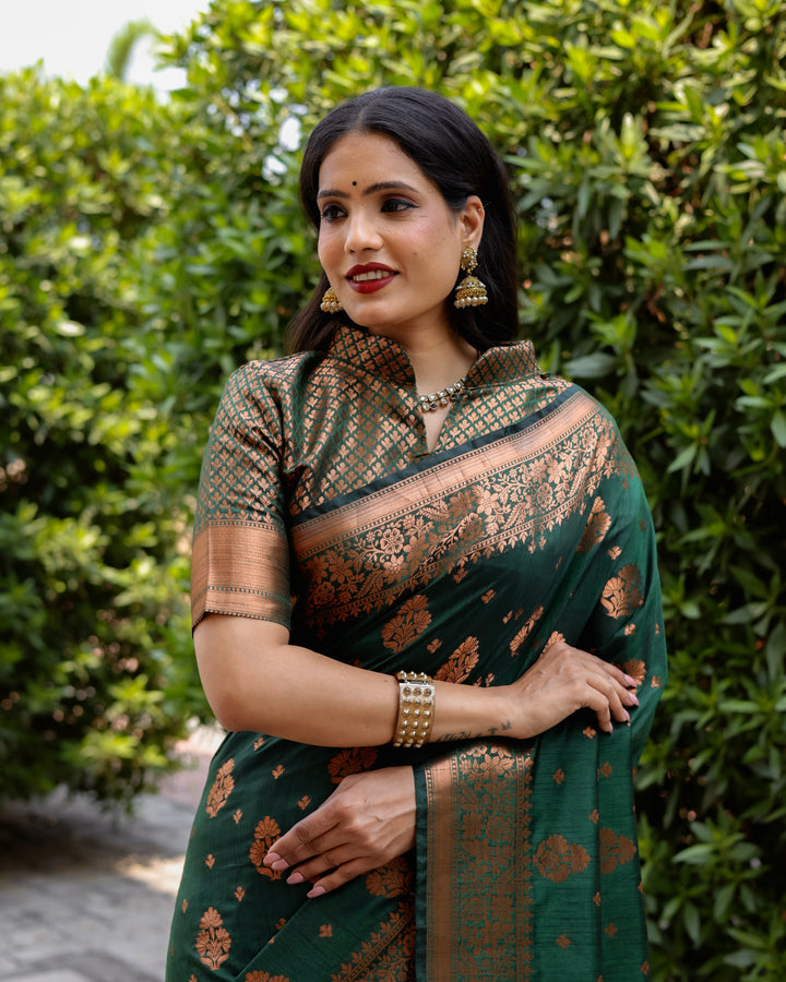 Elegant dark green soft silk saree with copper body and contrast woven borders, perfect for weddings and special gatherings.