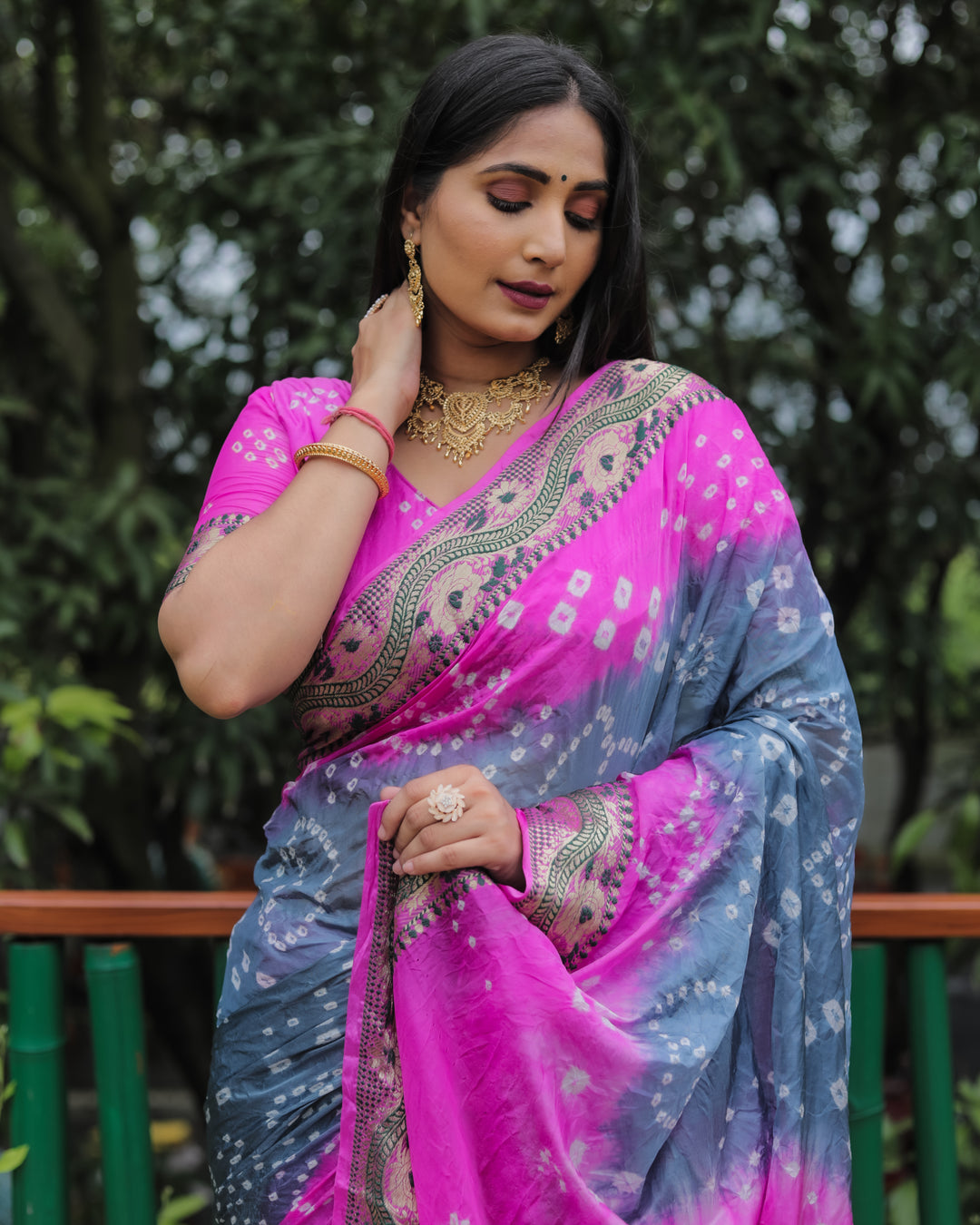 Timeless bright-pink Bandhej Tapeta silk saree with luxurious Bandhej pattern and dual-color style.