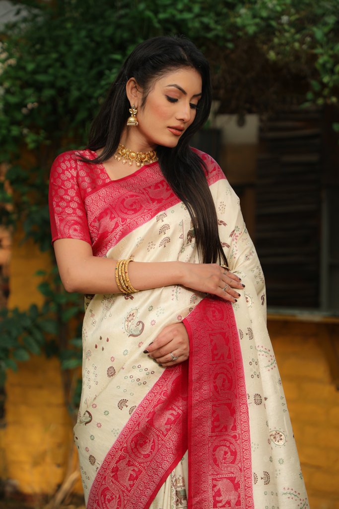 Elegant pink Kanjivaram soft silk saree with intricate weaving and traditional borders, perfect for cultural gatherings.