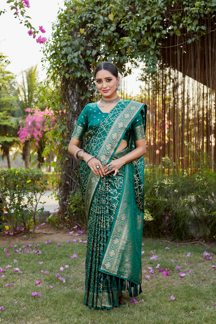 Elegant dark-green Kanjivaram soft satin silk saree with detailed butta work, perfect for traditional events and weddings.