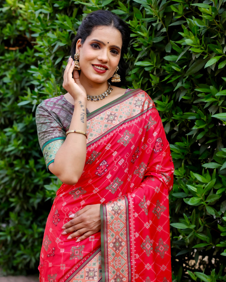 Adorn yourself with this red Ikkat Patola silk saree, featuring striking Zari borders and intricate designs that stand out at any celebration.