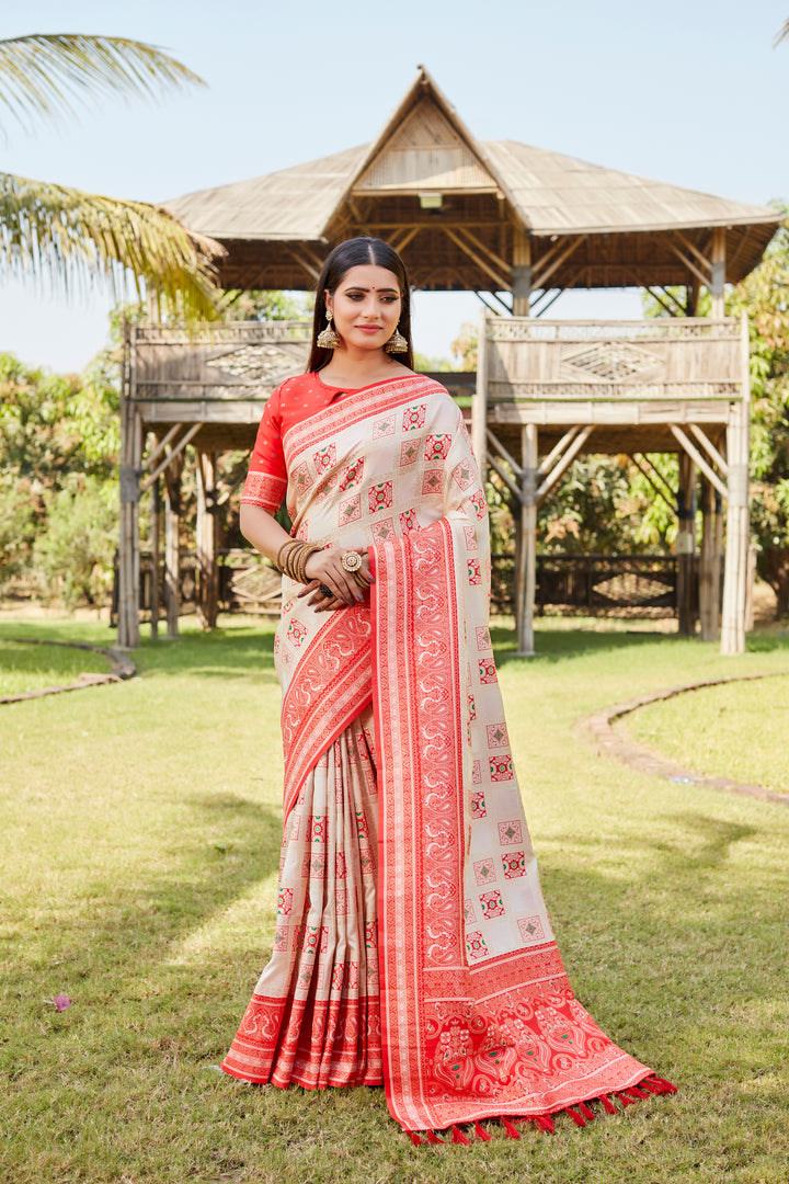 Soft pale-pink Kanjivaram soft silk saree with exquisite designer borders and fine detailing.