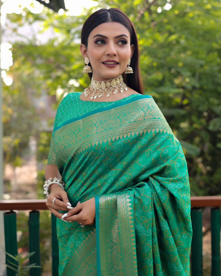 Beautiful mint-green Patola Silk Saree with delicate Zari work and Kanchi borders, perfect for USA weddings.