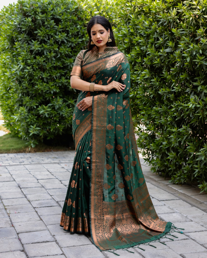 Beautiful dark green soft silk saree featuring intricate woven pallu and copper detailing, ideal for traditional events.