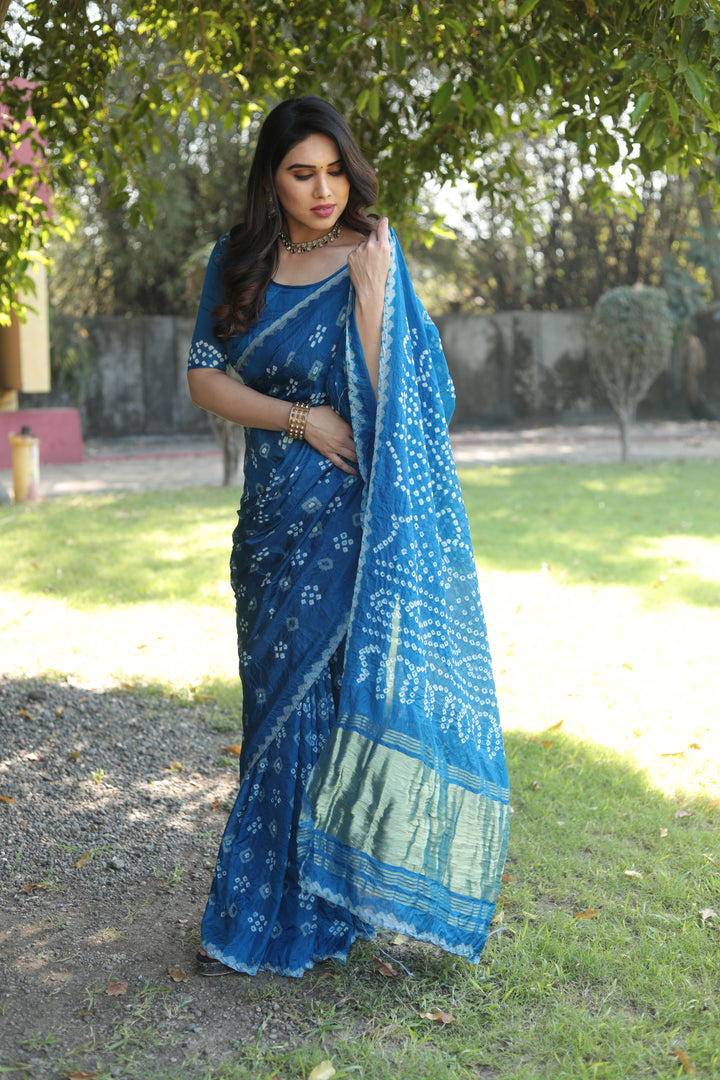 Luxurious Bandhej silk saree with intricate zari motifs and beautiful tissue pallu.