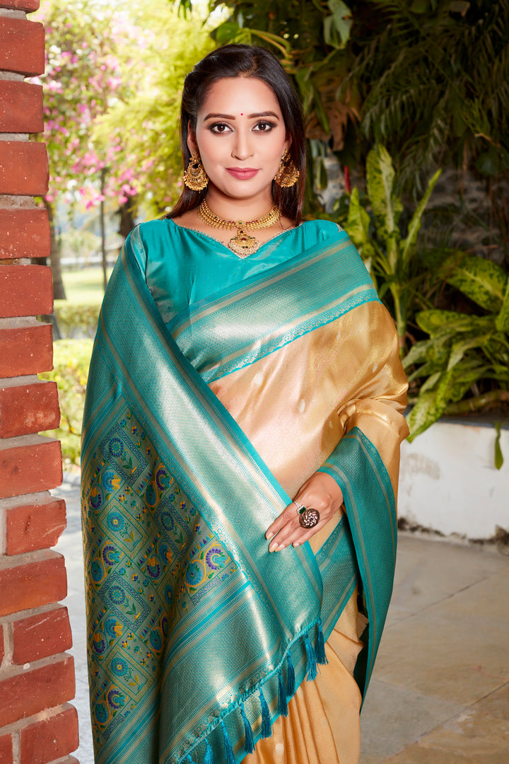 Timeless yellow tissue silk saree with rich pallu and contrast blouse, perfect for festive wear.