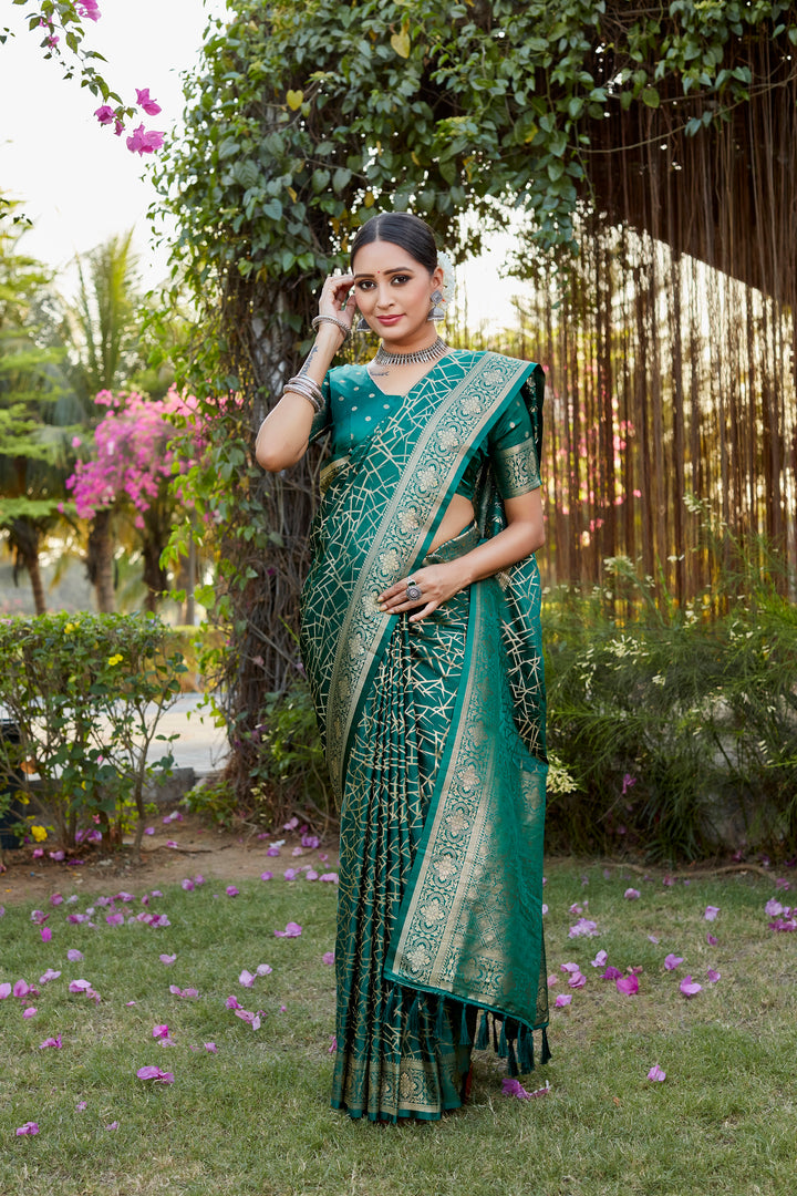 Stunning dark-green Kanjivaram soft satin silk saree with intricate butta design, ideal for formal and festive occasions.