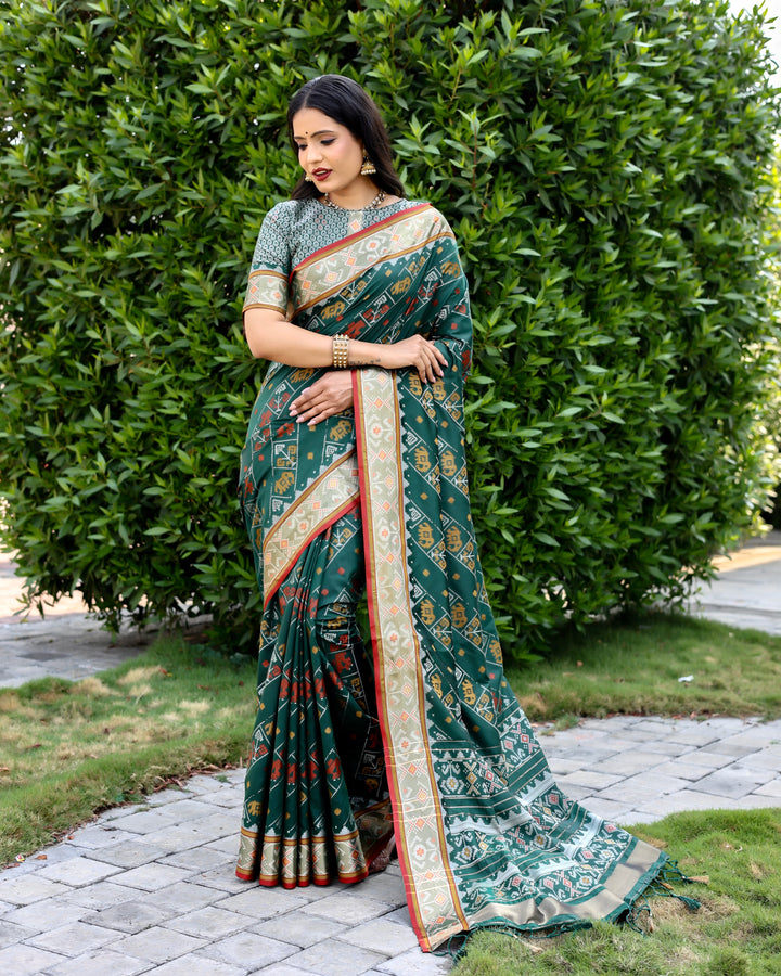 Stunning sea-blue Bandhej silk saree with intricate zari woven pallu and matching blouse, ideal for bridal wear.