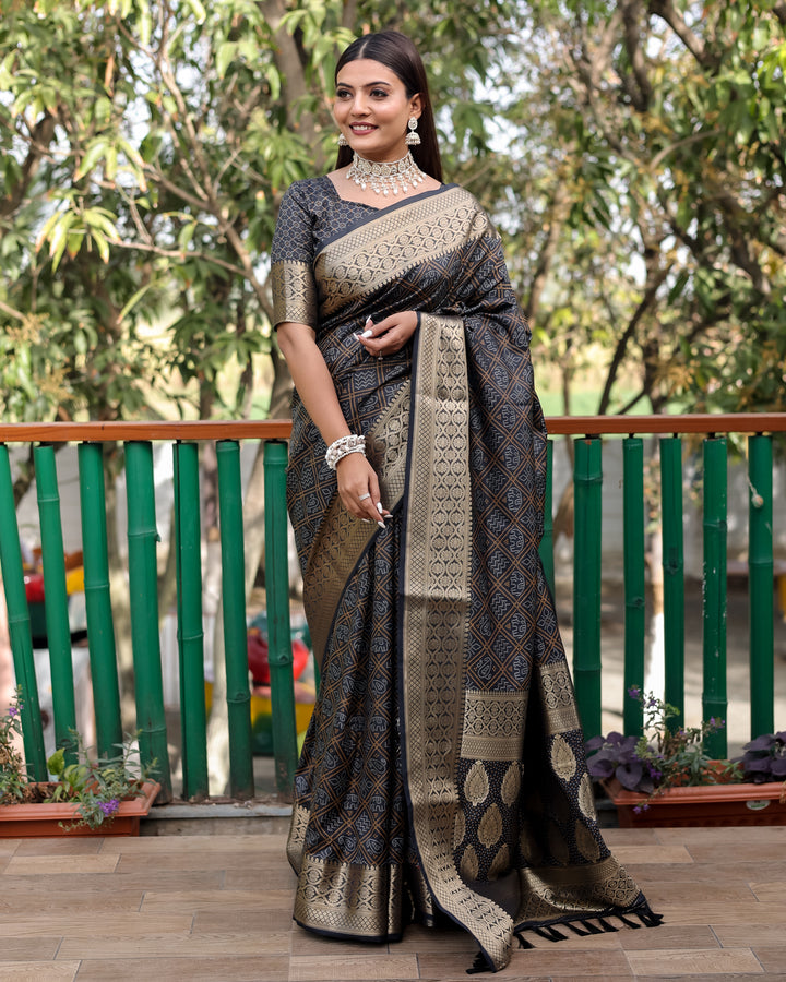 Elegant black saree adorned with Bandhej designs and a stunning contrast zari border, perfect for festive occasions.