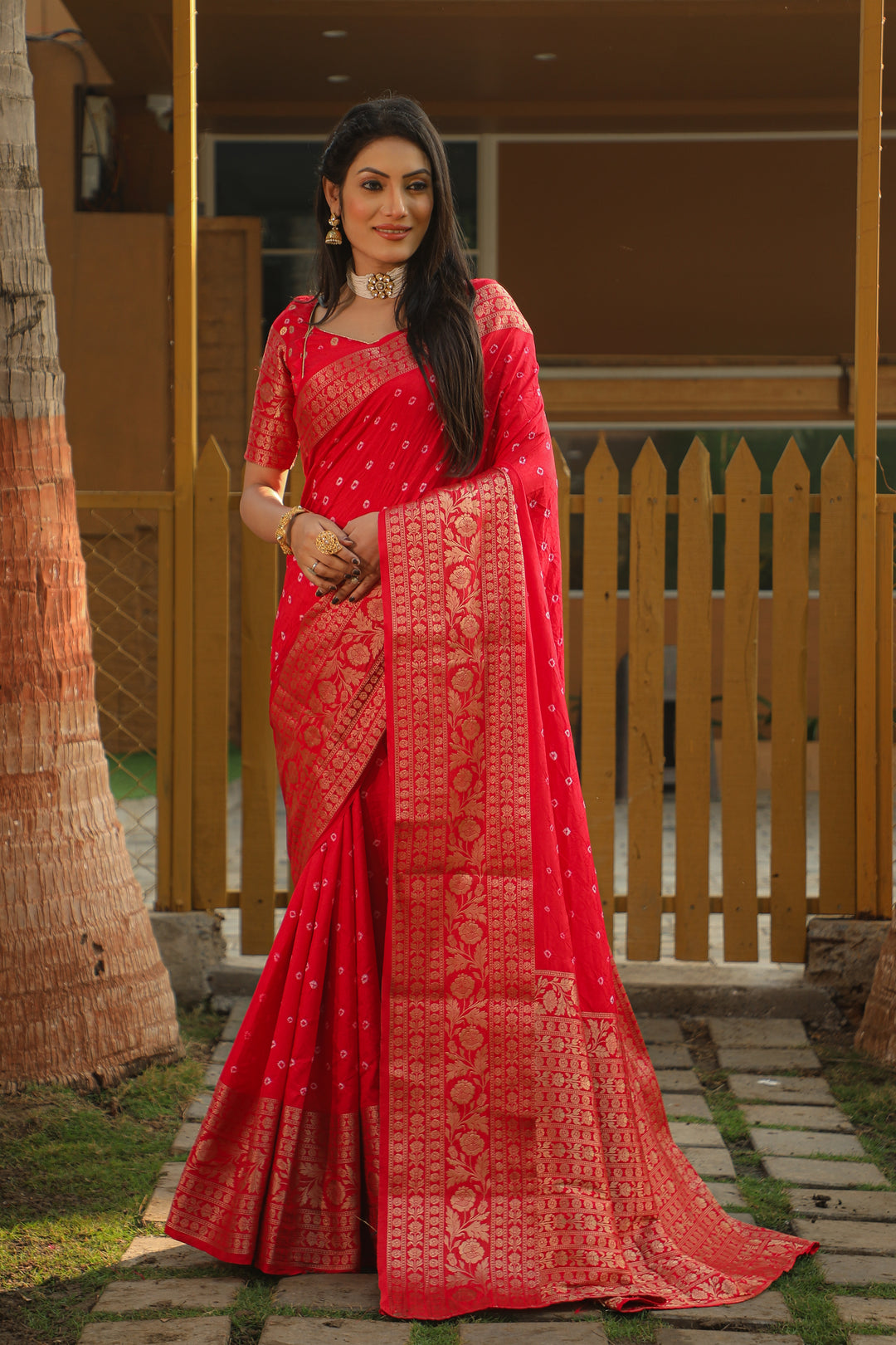 Elegant red Bandhej Kanjivaram silk saree featuring intricate zari weaving and rich pallu, perfect for weddings and special events.