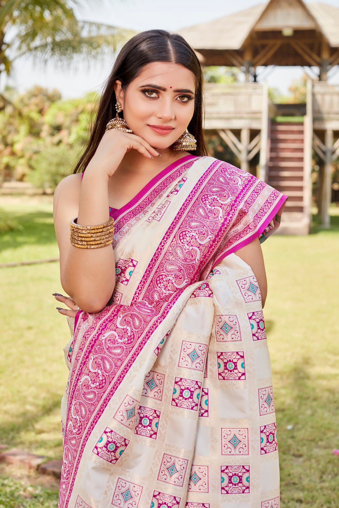 Elegant pale-pink Kanjivaram soft silk saree with beautiful designer borders and detailed motifs.