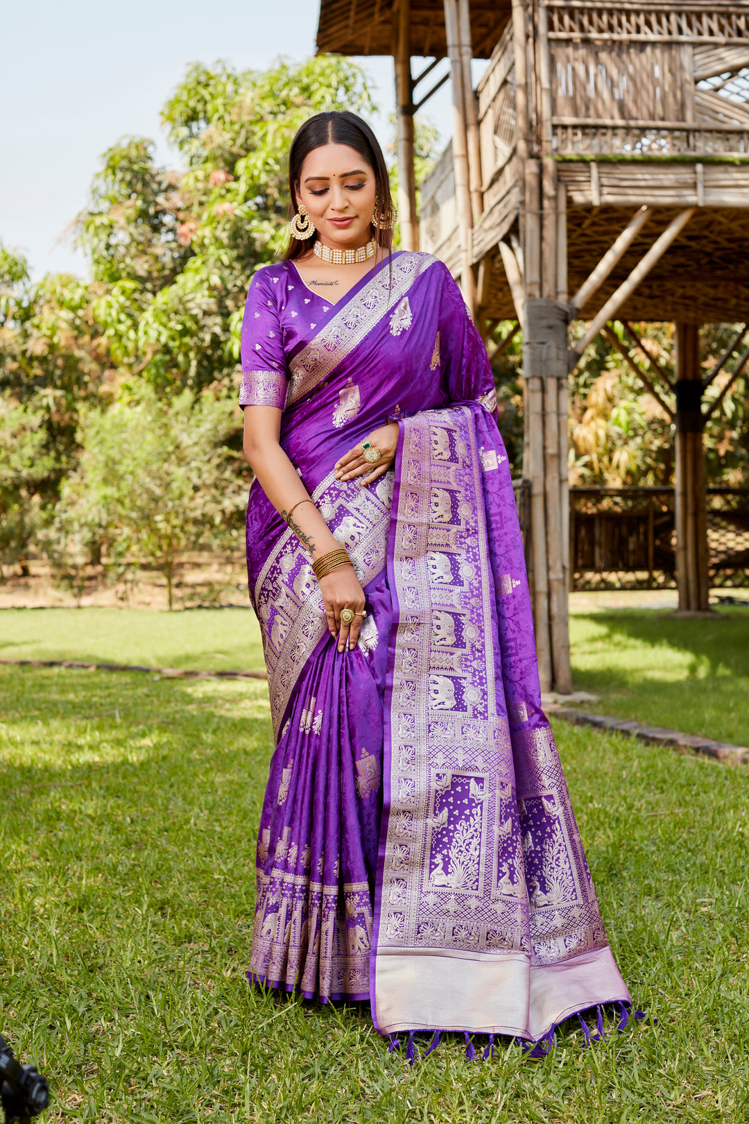 Elegant purple satin Kanjivaram saree with a traditional elephant border, perfect for weddings and cultural events.