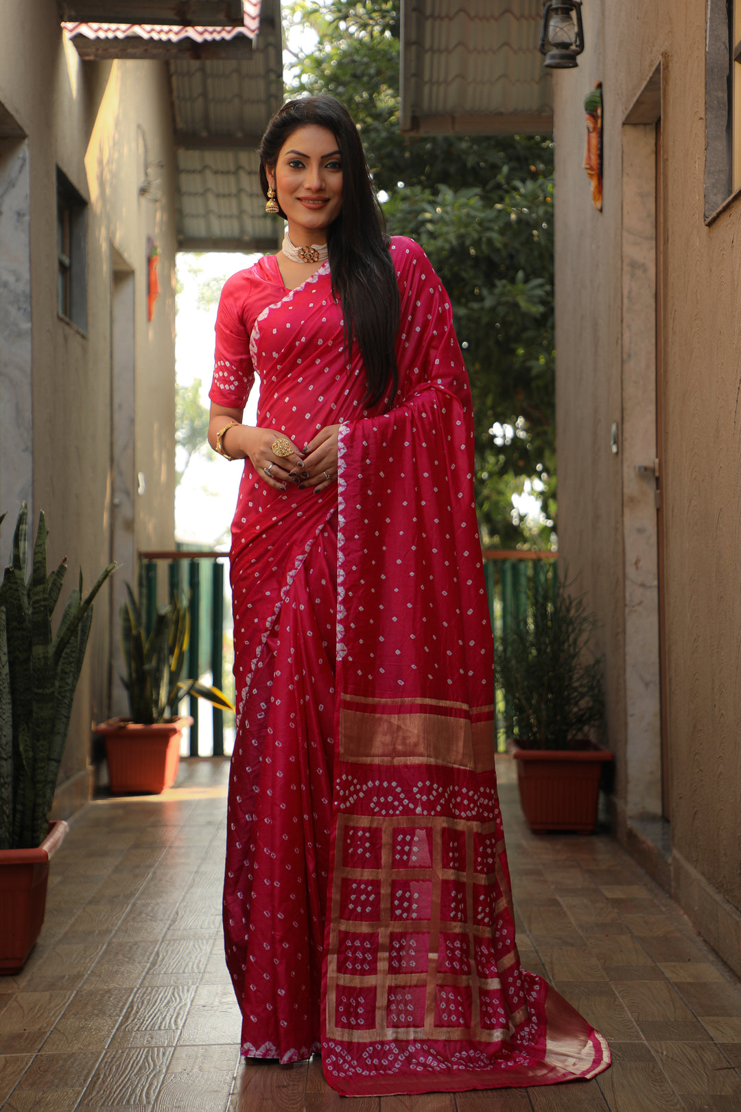 Beautiful bright-pink Bandhej silk saree with luxurious checks design and original craft.