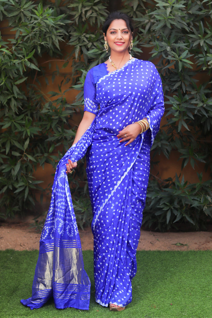 Royal blue Bandhej silk saree with Zari Weaving pallu, designed for Indian weddings and festive events.