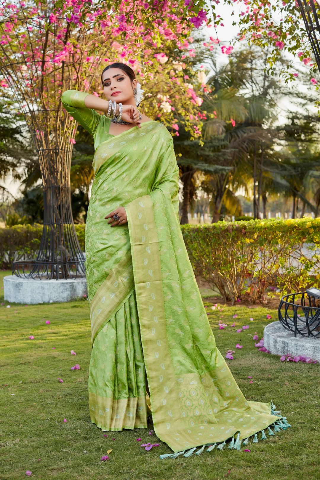 Stunning light-green Kanjivaram satin silk saree with intricate butta design and woven pallu, perfect for weddings.