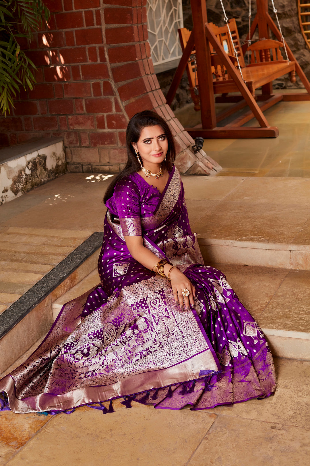 Stunning purple saree with soft satin fabric, intricate weaving, and a designer pallu, making it the perfect choice for special celebrations.