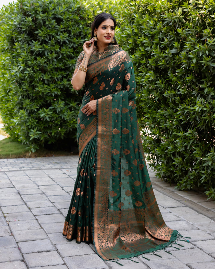 Timeless dark green soft silk saree with rich copper accents and contrast border, designed for special occasions.