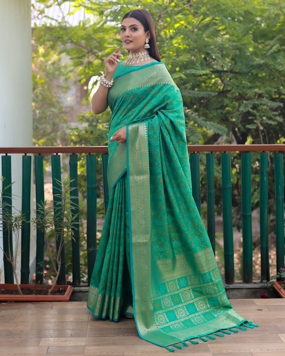 Handloom Bandhej Patola Silk Saree in mint-green with intricate Zari & Kanchi borders, ideal for USA weddings.