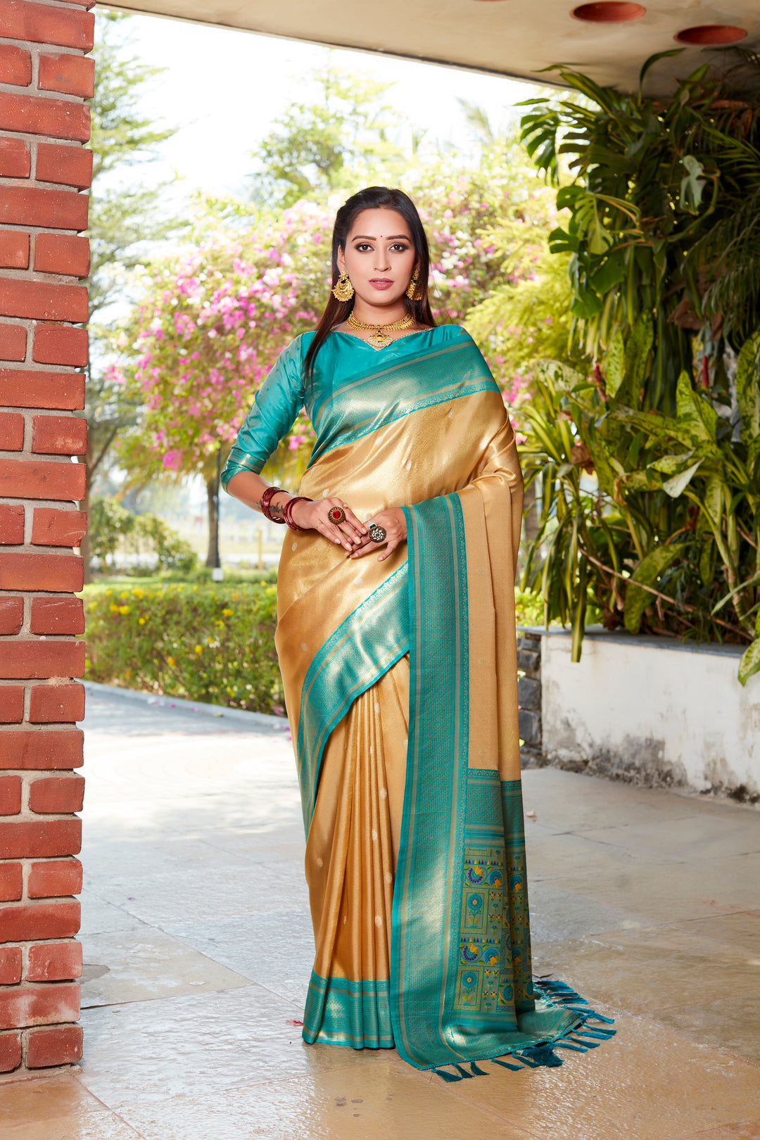 Elegant yellow tissue silk saree with a beautiful pallu and contrast blouse, ideal for traditional celebrations.