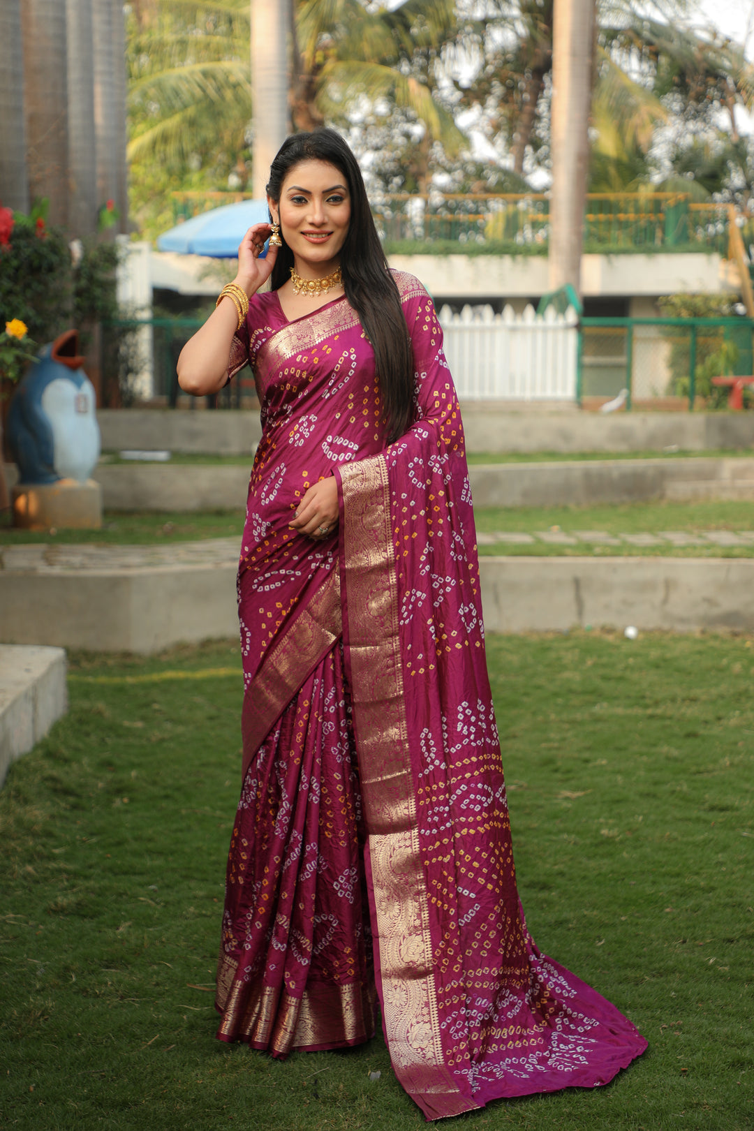 Deep wine Bandhej silk saree with a beautiful jari weaving border and Bandhej pallu, ideal for festive wear.