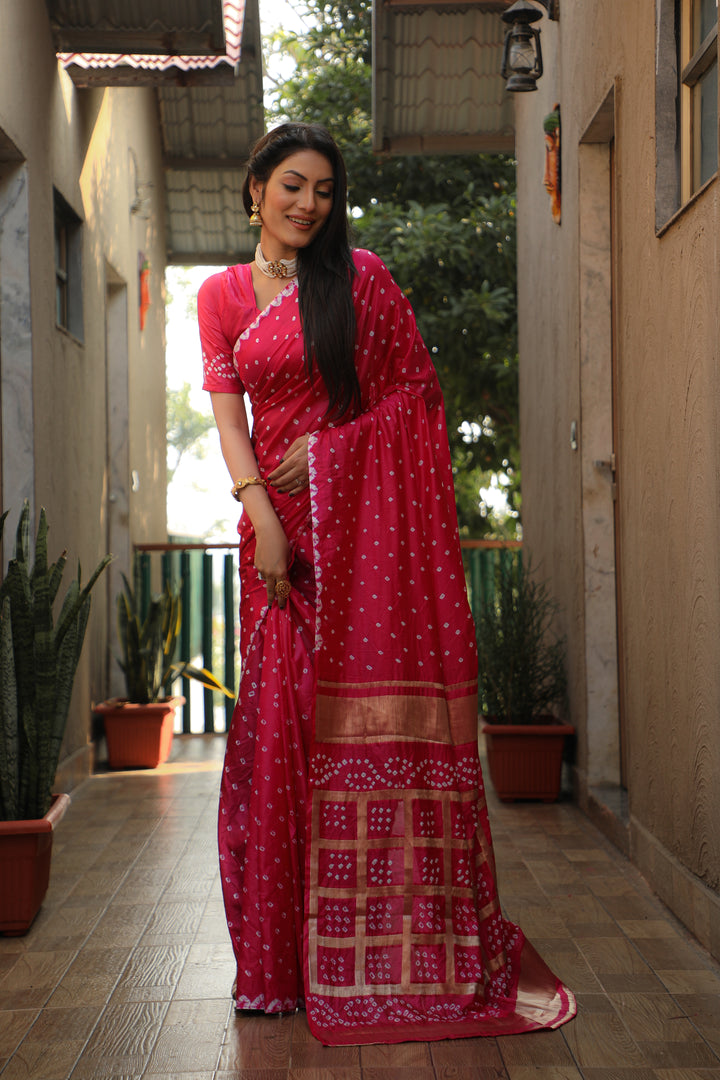 Timeless bright-pink Bandhej silk saree with beautiful checks pattern for special occasions.