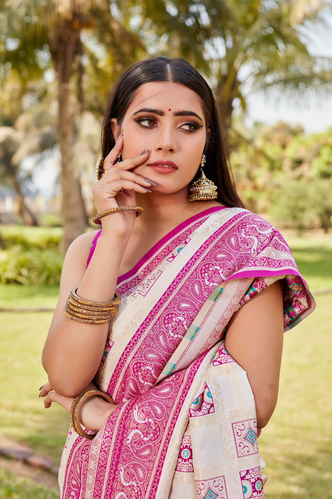 Timeless pale-pink Kanjivaram soft silk saree with intricate work and luxurious designer borders.