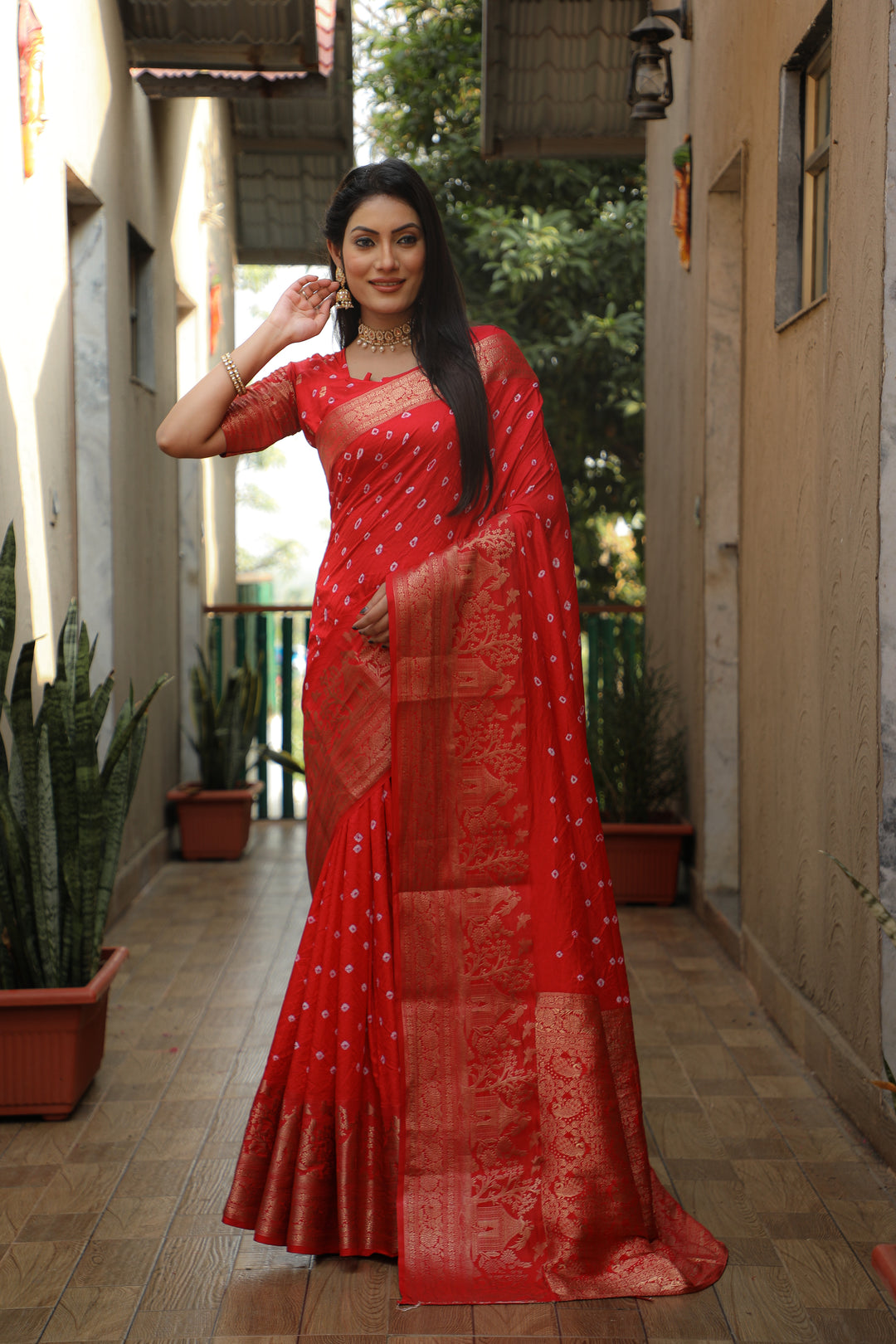 Red Kanjivaram silk saree with rich pallu and vibrant design, perfect for weddings and festive events.