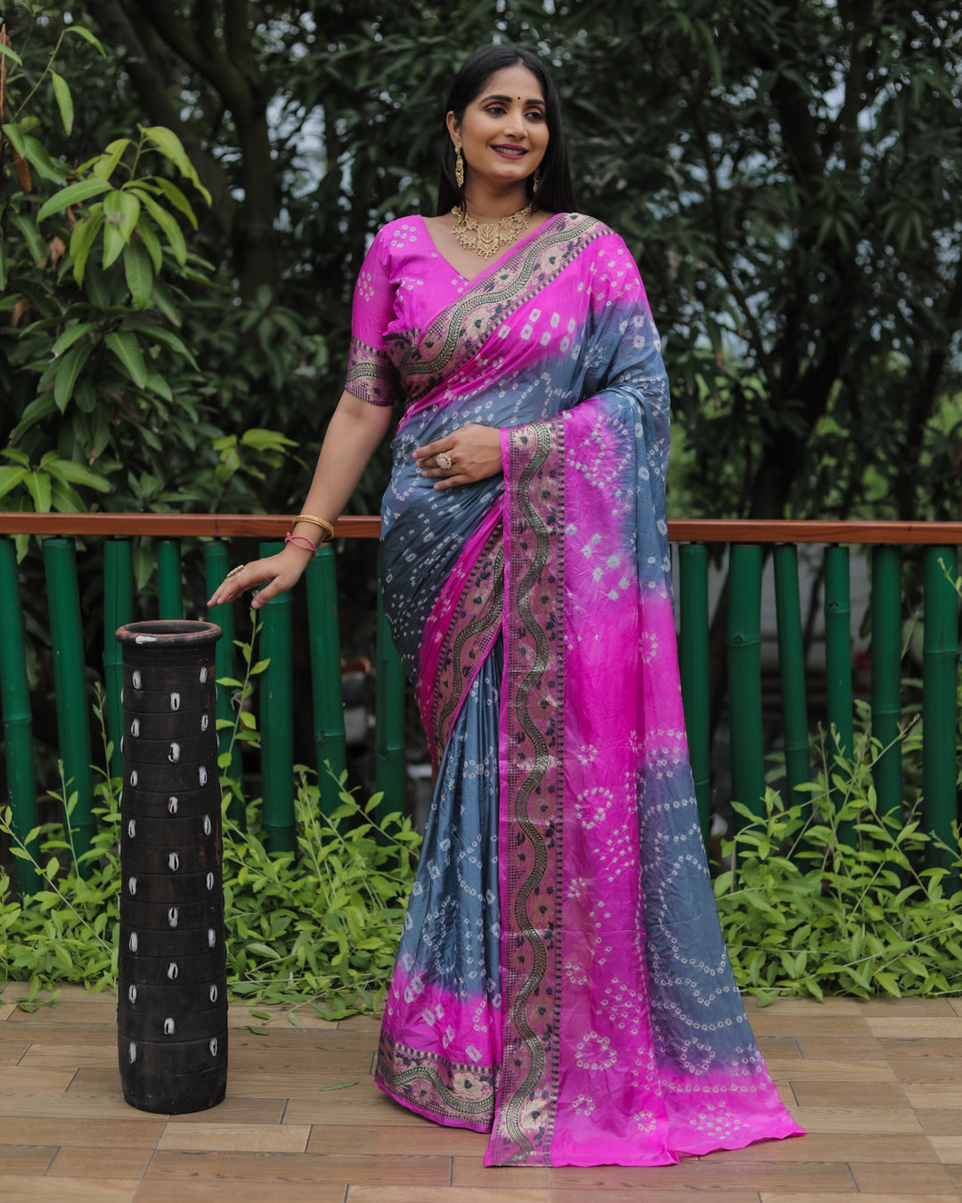 Elegant bright-pink Bandhej Tapeta silk saree with vibrant dual-color design, perfect for celebrations.