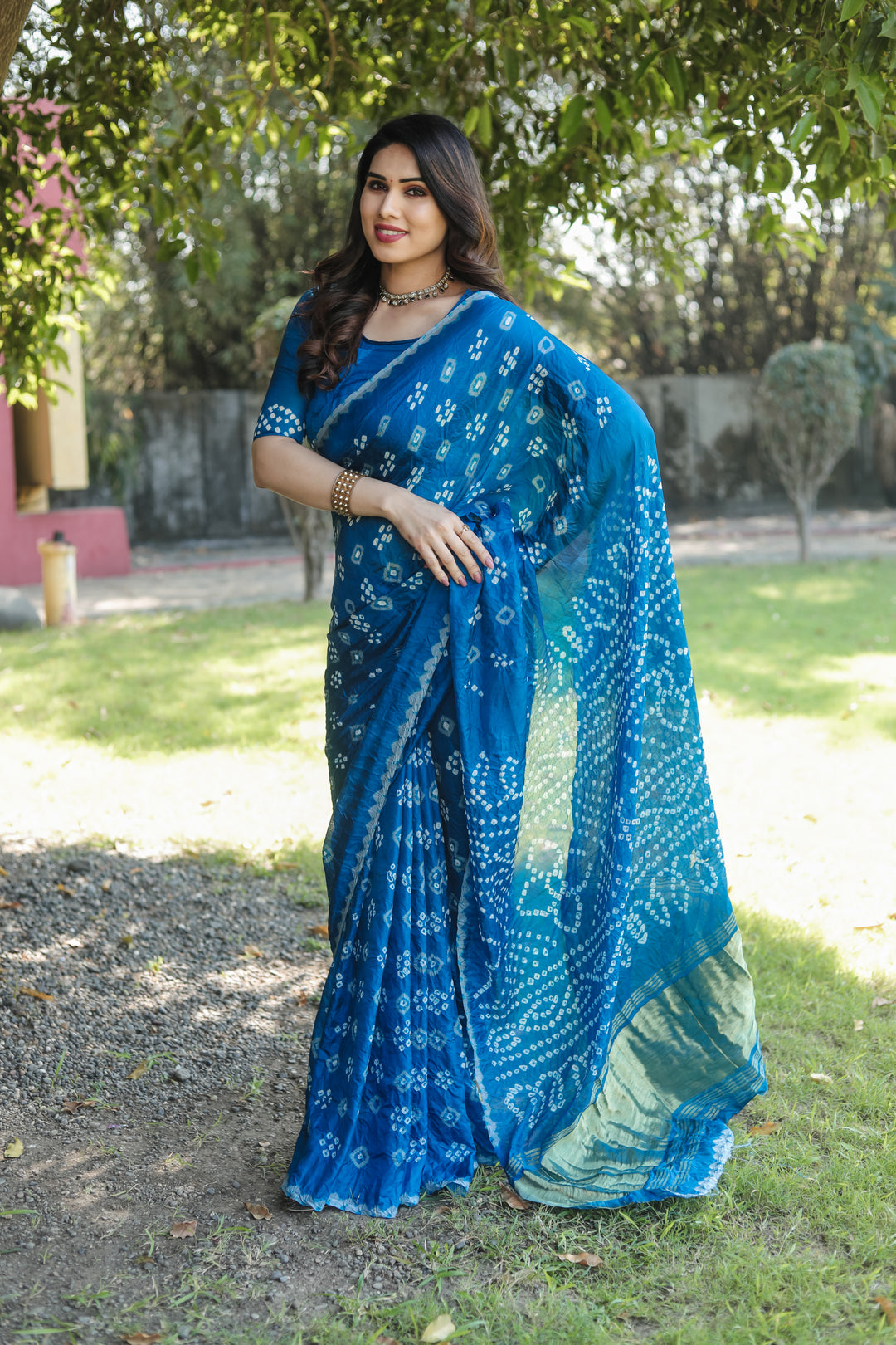 Traditional Bandhej silk saree with exquisite tissue pallu and elegant zari weaving.