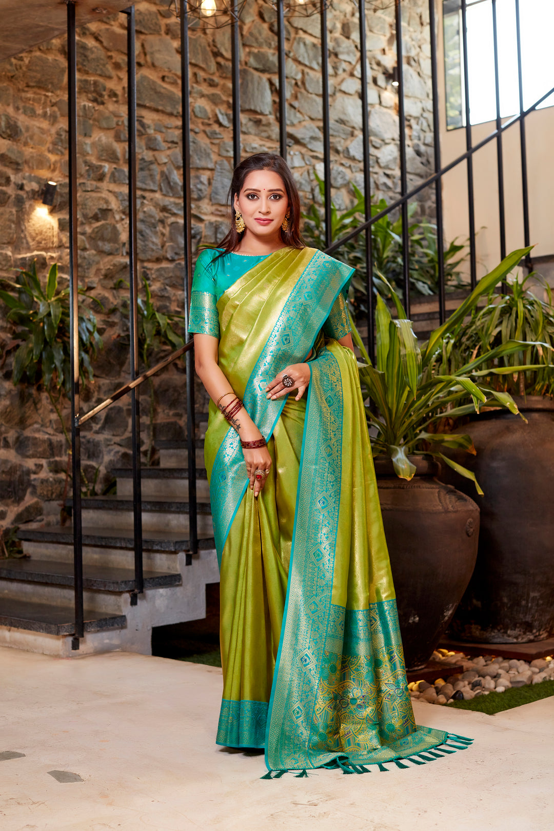 Timeless olive Tissue silk saree with intricate weaving and bold contrast border.