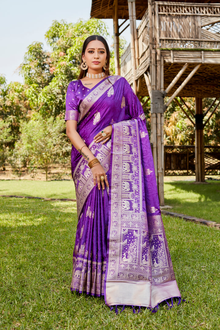 Stunning purple satin Kanjivaram saree with a beautiful elephant border design, ideal for special occasions and celebrations.