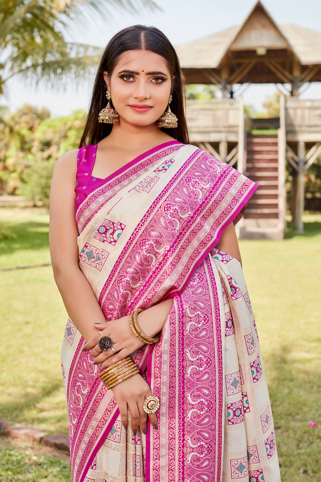 Soft pale-pink Kanjivaram silk saree with fancy designer borders and intricate traditional design.