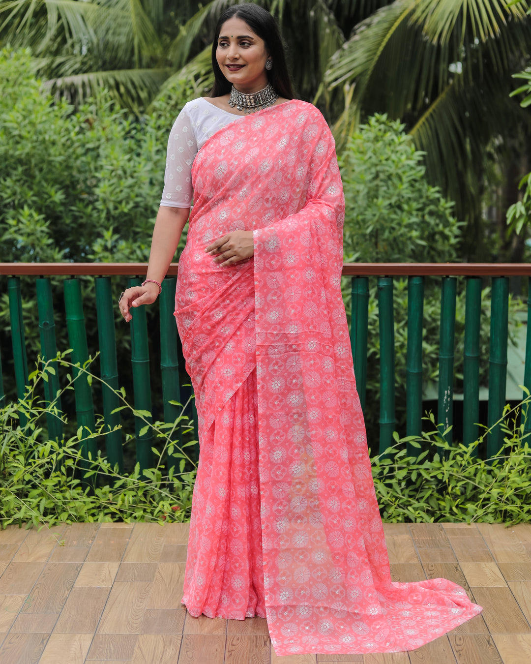 Soft peach chiffon saree with foil accents, perfect for festive occasions and special celebrations.