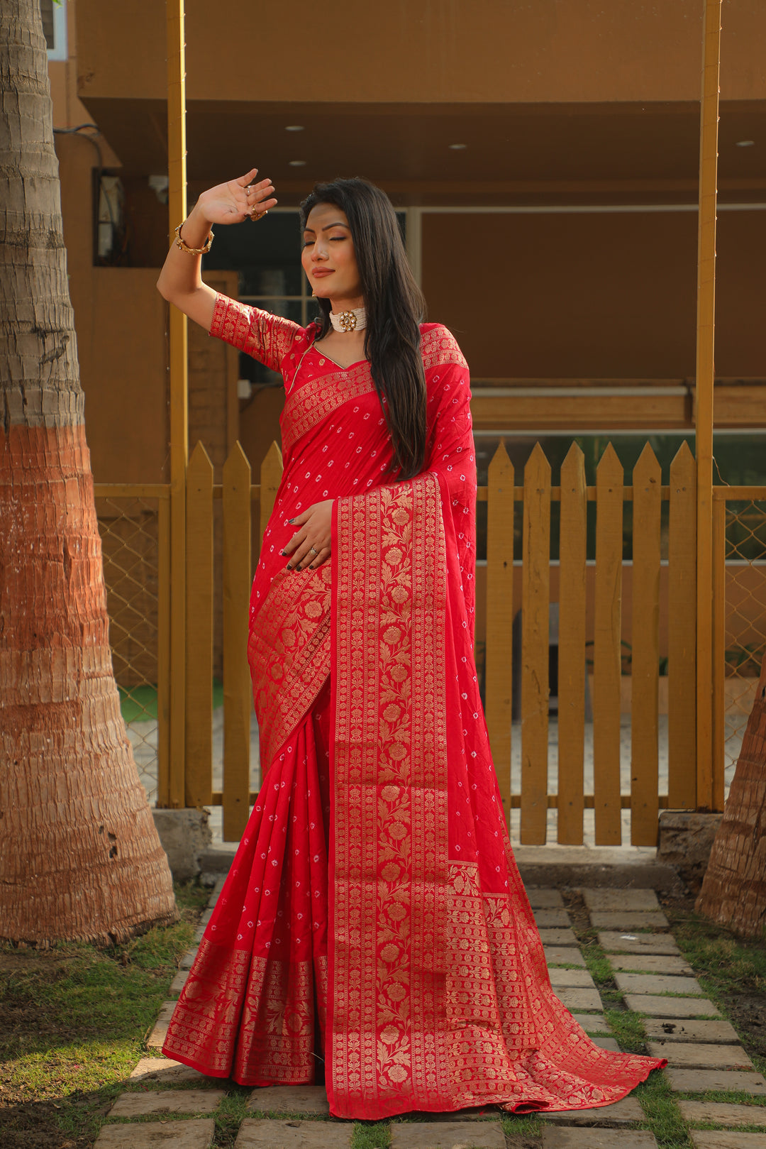 Elegant teal green Bandhej Kanjivaram silk saree with intricate zari weaving and a rich pallu, perfect for bridal wear and cultural events.