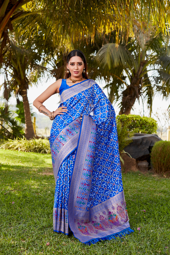 Purple Gharchola Bandhej silk saree featuring intricate zari weaving and meenakari borders, ideal for weddings and celebrations.