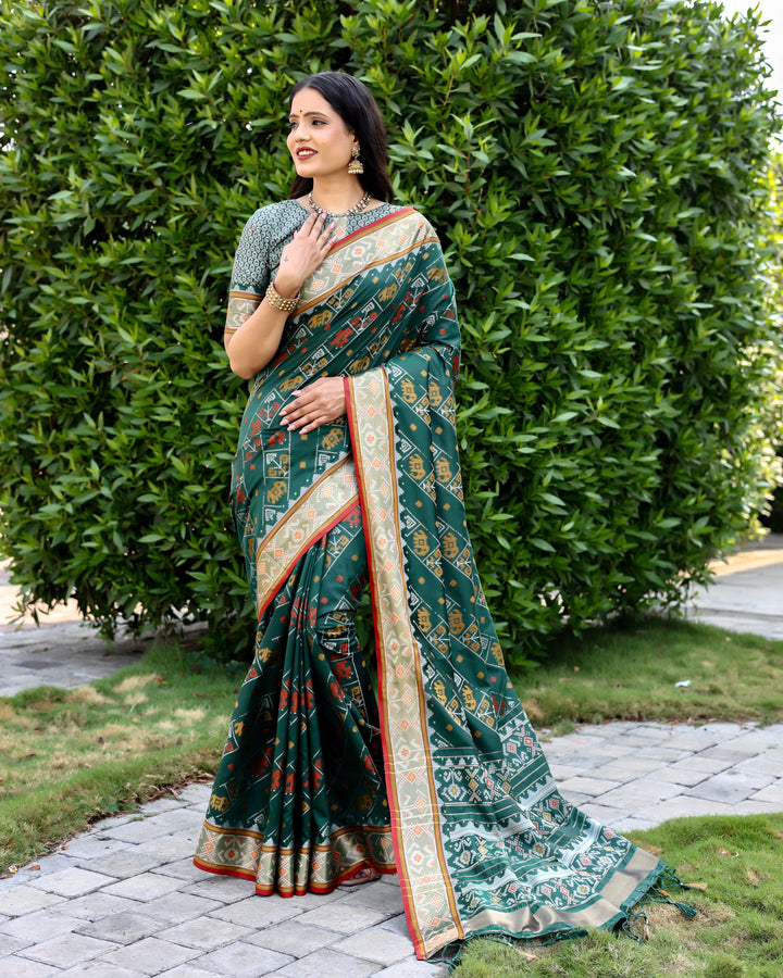 Gorgeous dark-green Bandhej silk saree with zari woven pallu and matching blouse, ideal for festive celebrations.