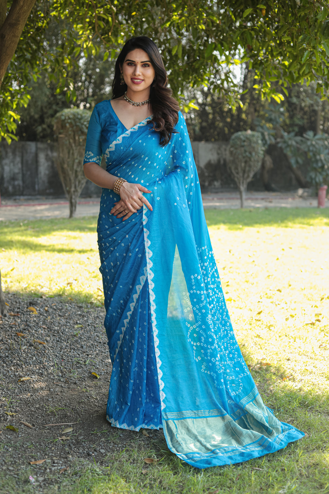 Sky-Blue Bandhej Silk Saree with intricate Zari weaving and Pallu for a royal, traditional look.