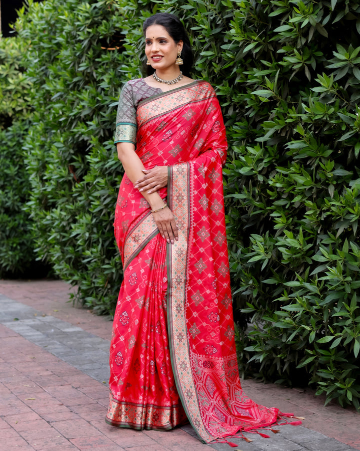 Celebrate in style with this red Ikkat Patola silk saree featuring intricate Ikkat designs and stunning Zari borders, perfect for weddings.