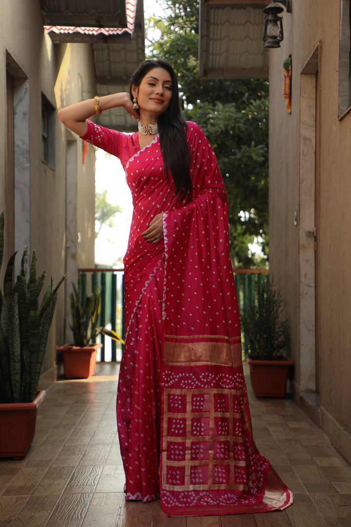 Bright-pink Bandhej silk saree with elegant checks pattern and original craftsmanship.